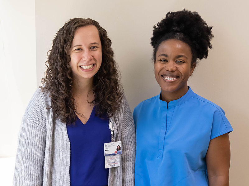 Dr. Gabrielle Banks, right, and School of Medicine Psychiatry Resident Lauren Mutignani work together at the Center for the Advancement of Youth.
